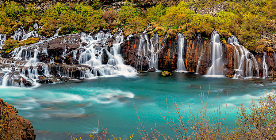 Panoramic view of the Hraunfossar Waterfall in Iceland.