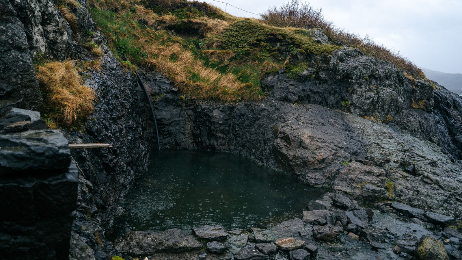 Hellulaug Hot Spring in Westfjords, Iceland.